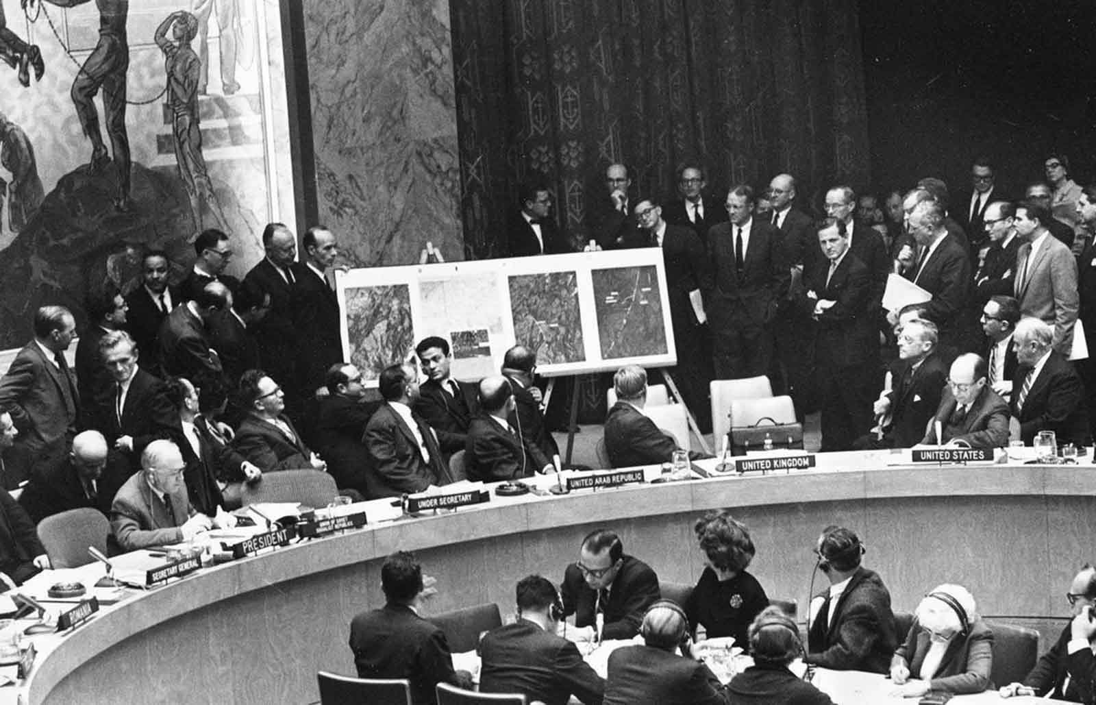 U.S. Ambassador to the United Nations, Adlai Stevenson, second from right, confronts Soviet delegate Valerian Zorin, first on left, with a display of reconnaissance photographs during emergency session of the U.N. Security Council at the United Nations headquarters in New York, on October 25, 1962.